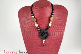 Necklace designed with black marble, onyx and metal beads